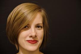 headshot of Elizabeth Hughes with black background