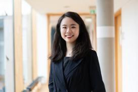 Leije Zeng posing in the MPIWG hallway
